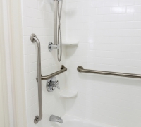Custom bath tub with grab bar and hand shower for senior people